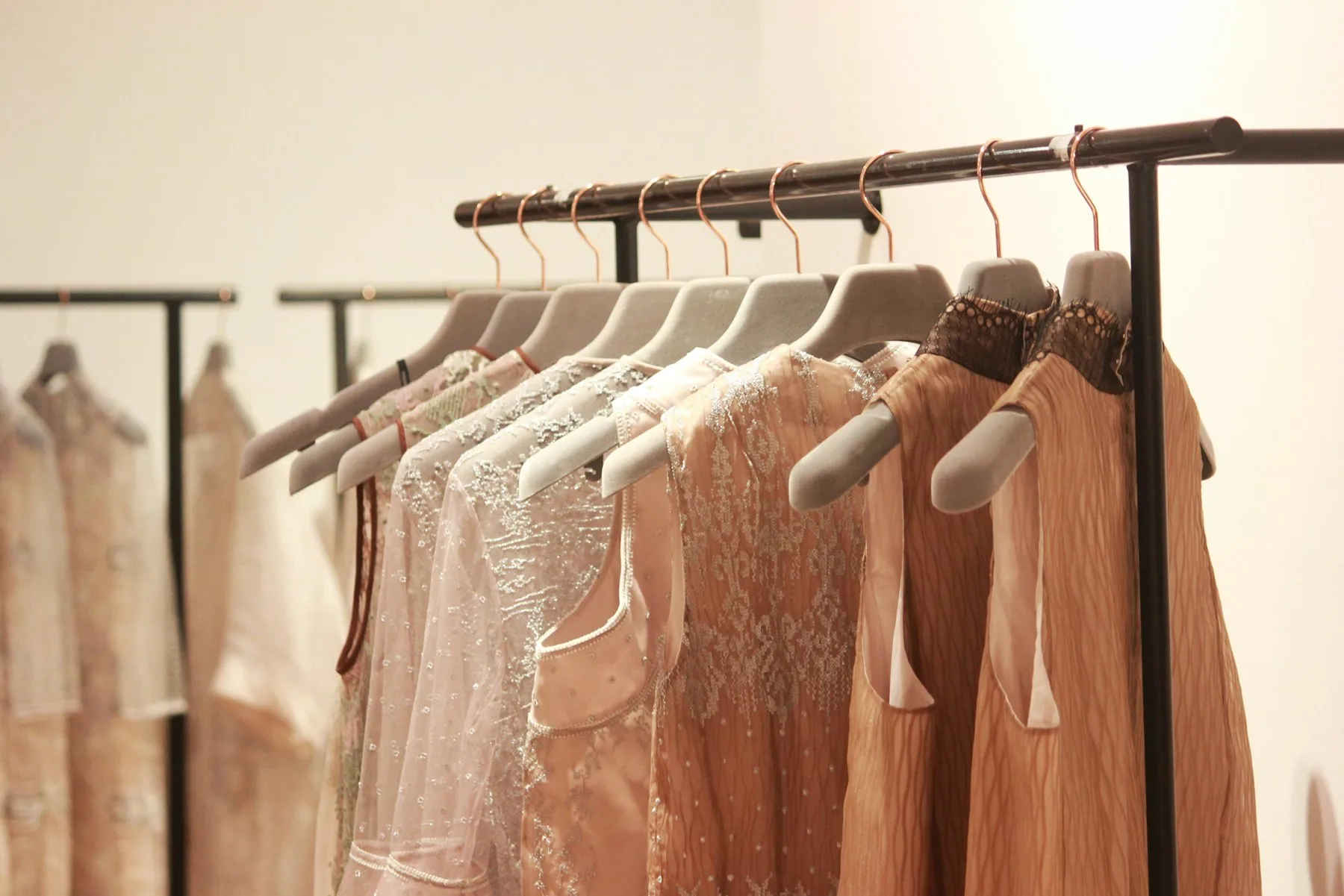 Garments hanging on a rail, ready for the show